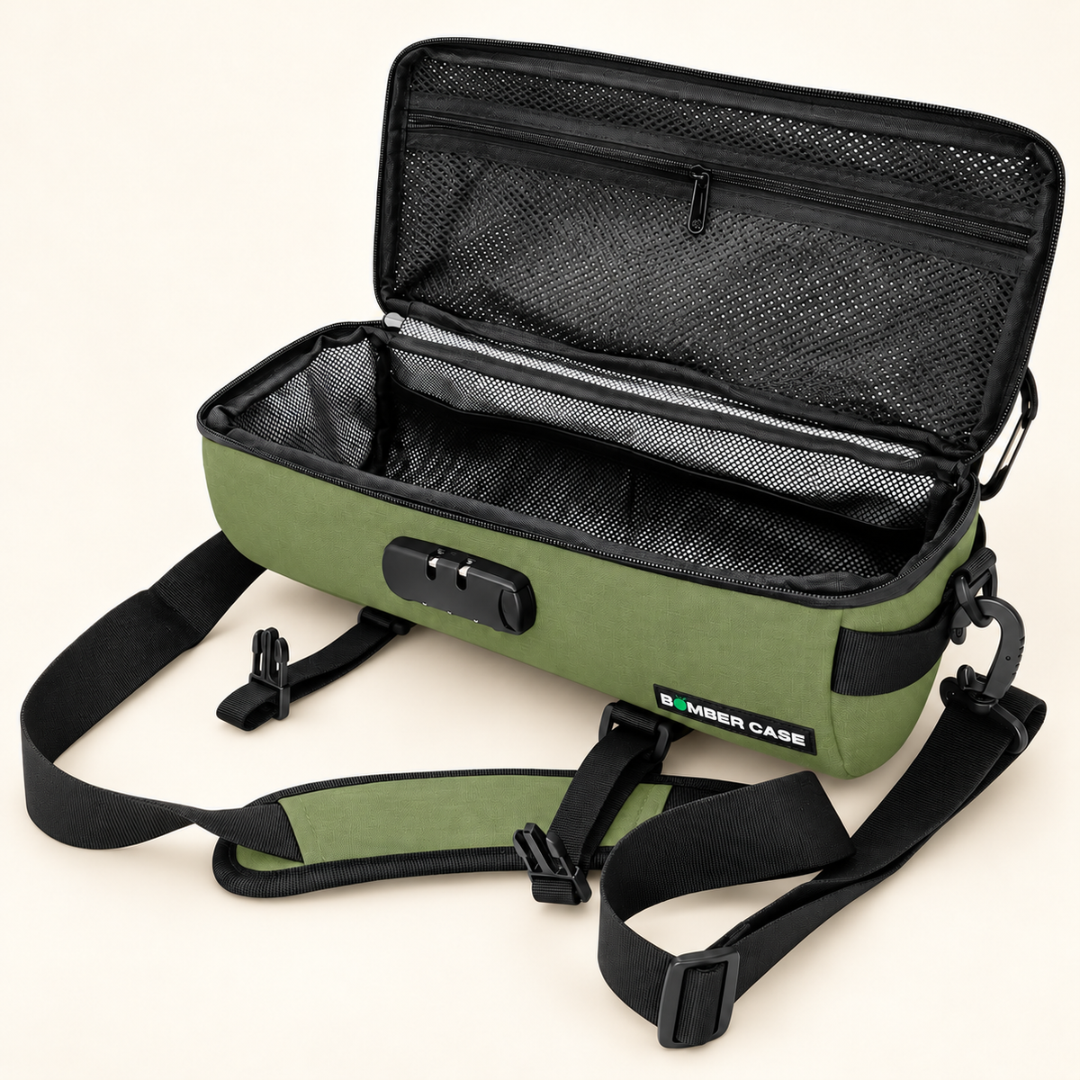 Open green 14-inch Bomber Case duffle showing its mesh pockets, padded interior and removable shoulder strap.
