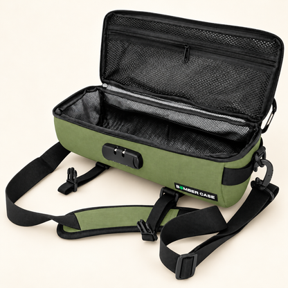 Open green 14-inch Bomber Case duffle showing its mesh pockets, padded interior and removable shoulder strap.