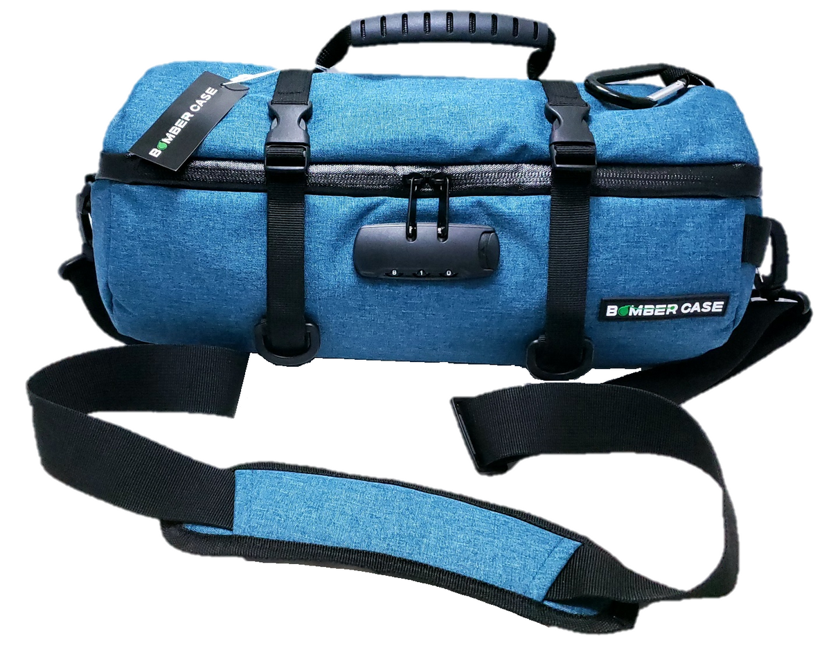 Blue 14-inch Bomber Case locking duffle with cinch straps, combination lock and padded shoulder strap.